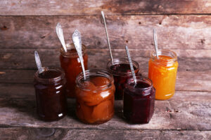 Jars,Of,Tasty,Jam,On,Wooden,Background
