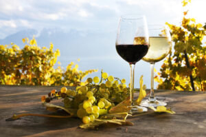 Pair,Of,Wineglasses,And,Bunch,Of,Grapes.,Lavaux,Region,,Switzerland