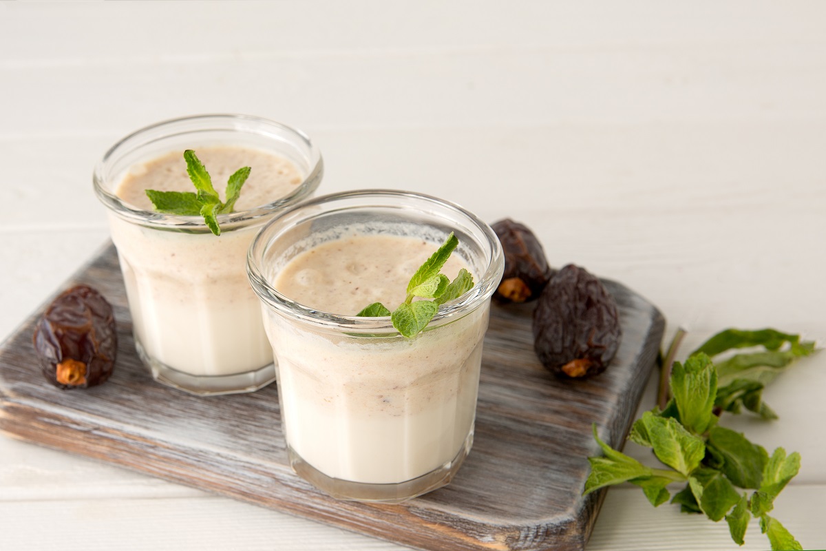 Glasses,With,Date,And,Milk,Smoothies,On,A,Light,Wooden