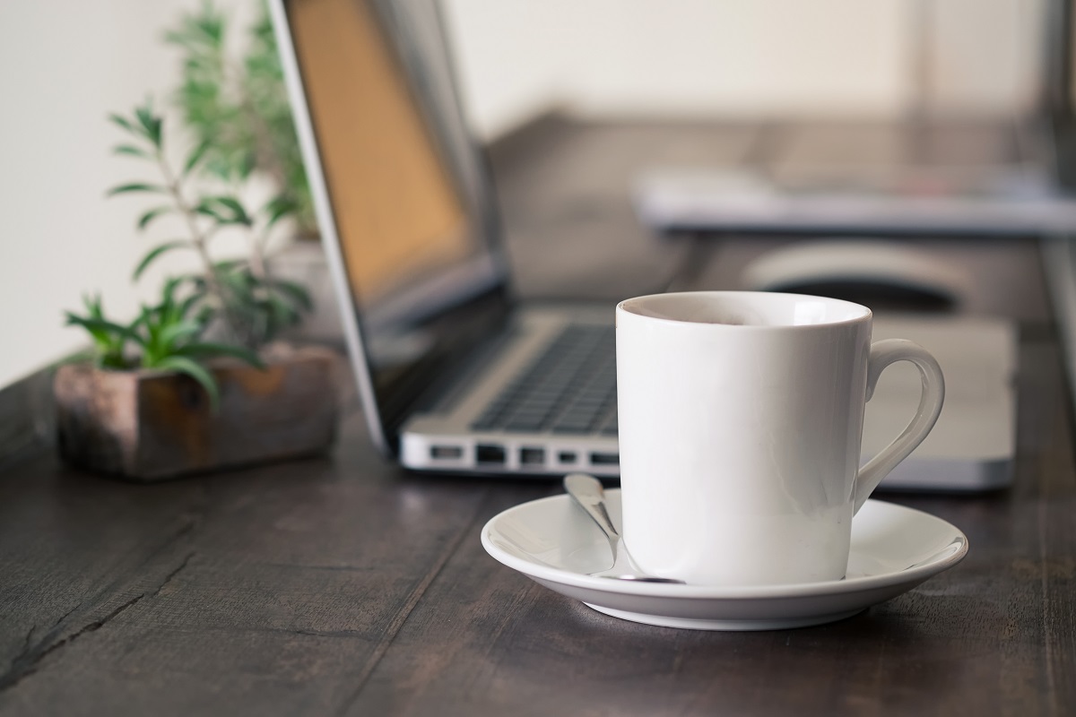 Mug,Coffee,On,Wooden,Work,Table.