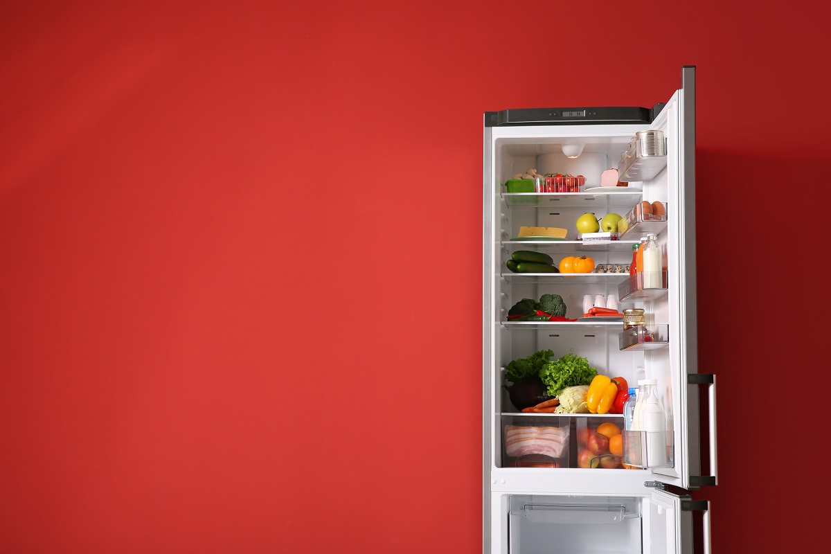 Open,Fridge,Full,Of,Food,Near,Color,Wall