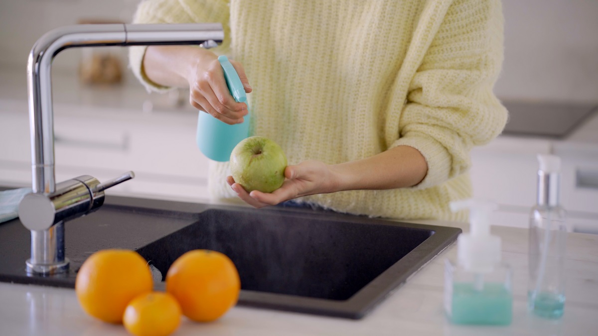 Crop,Of,Female,Hands,Washing,Apples,And,Fruit,With,Soap