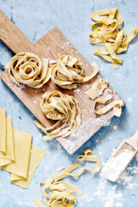 Raw,Yellow,Homemade,Italian,Pasta,Pappardelle,,Fettuccine,Or,Tagliatelle,On