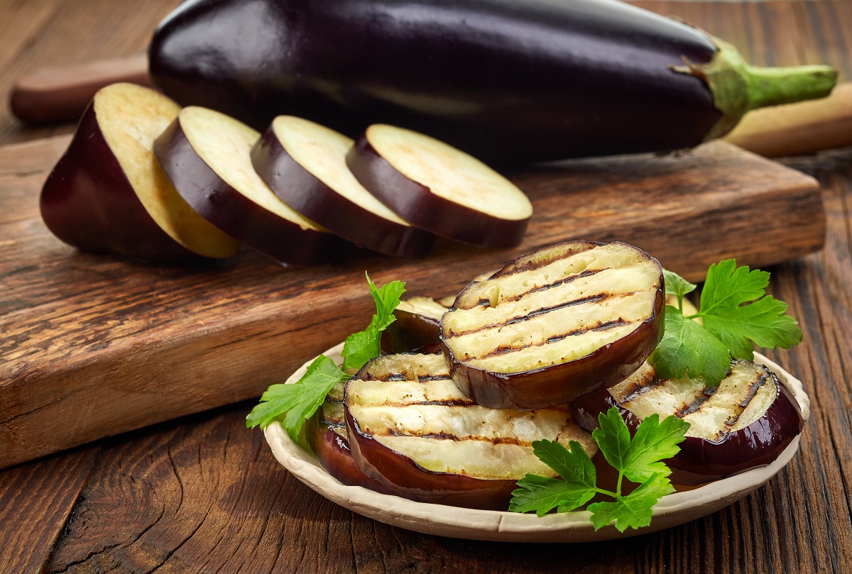 Grilled,Eggplant,And,Parsley,Leaves,On,Wooden,Table