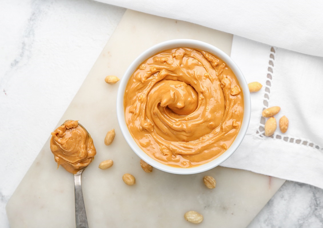 Bowl,With,Tasty,Peanut,Butter,On,Table