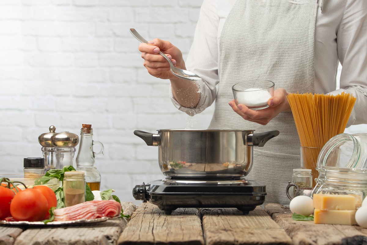The,Chef,Salts,Boiling,Water,In,A,Saucepan,For,Cooking