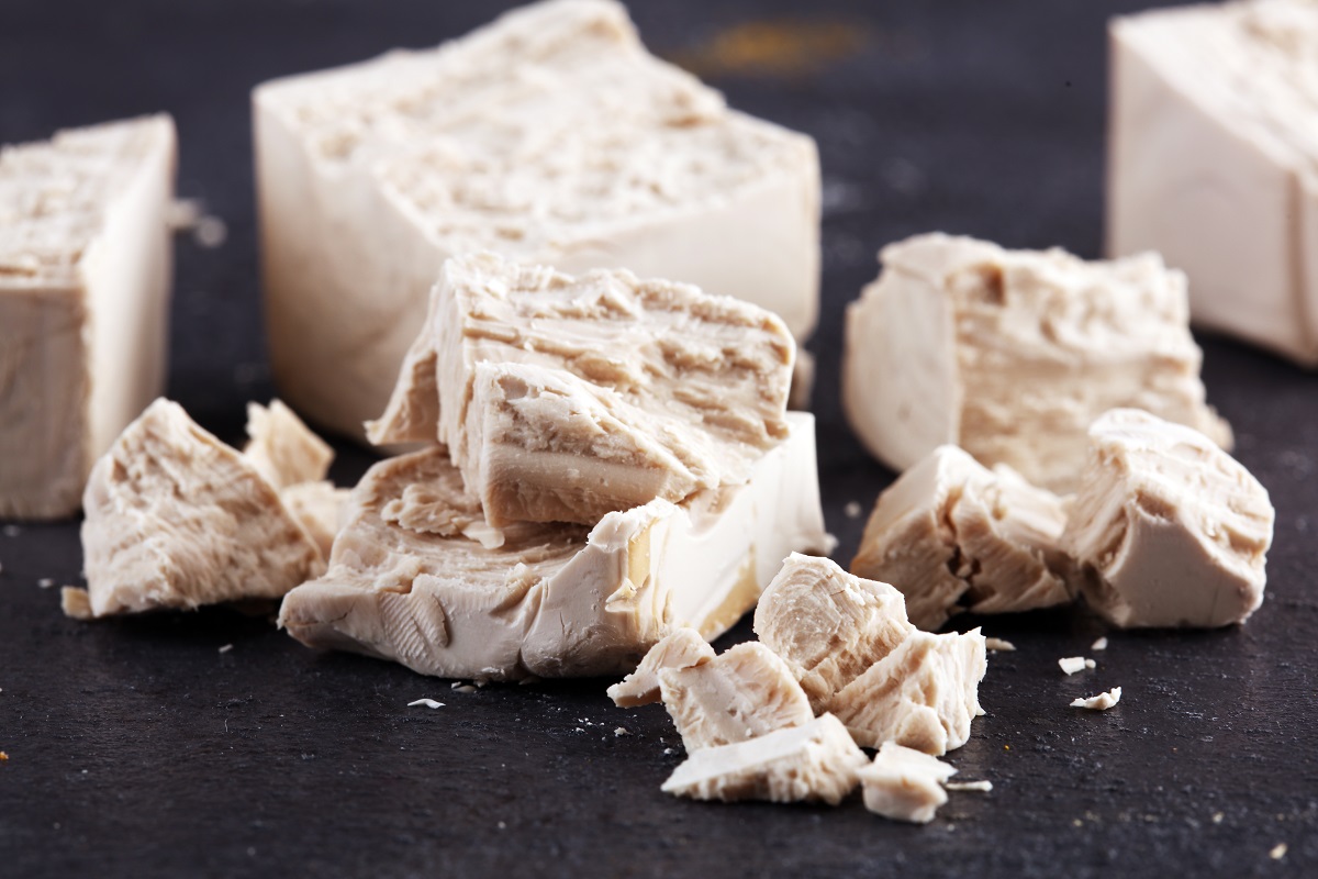 Dry,Yeast,Crumbled,And,Yeast,Block,For,Baking,On,Table
