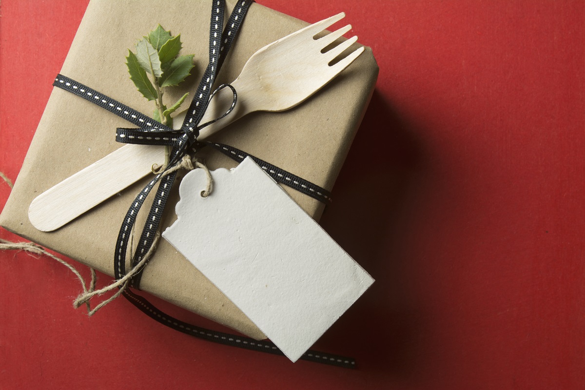 Gift,Box,,Wrapped,In,Recycled,Paper,,Black,Bow,And,Wooden