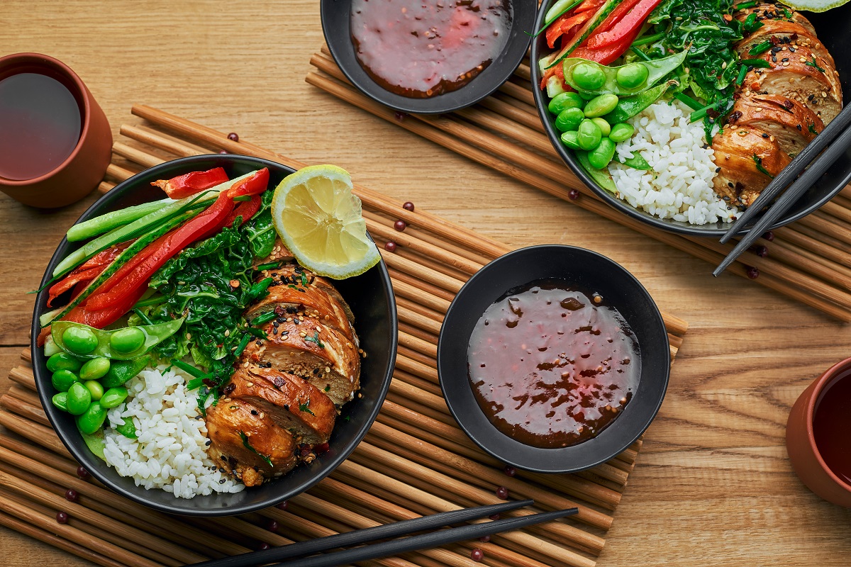 Couple,Of,Delicious,Buddha,Bowls,With,Teriyaki,Chicken,,Fresh,Vegetables,