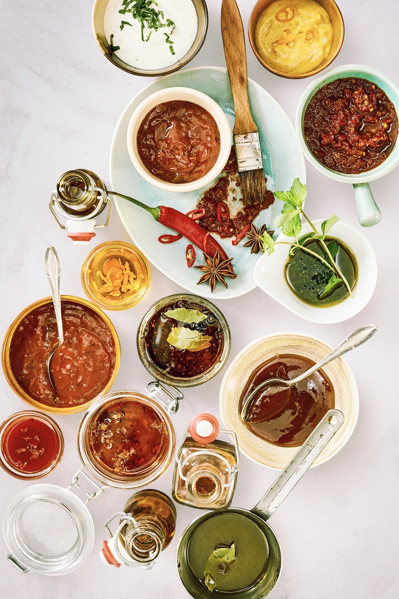 Overhead,View,Of,Red,Marinade,And,Green,Pesto,With,Herbs