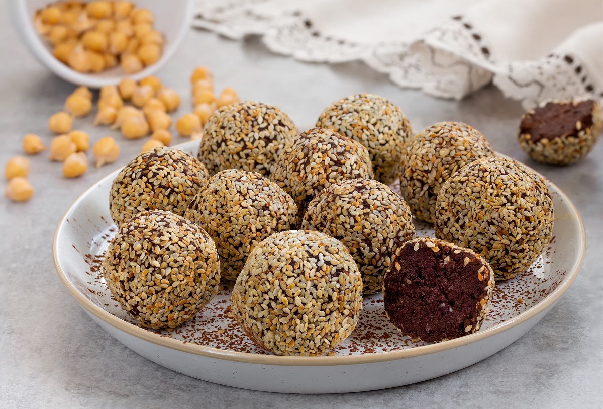 Chocolate,Chickpea,Truffles,Coat,With,Sesame,Seeds,On,A,White