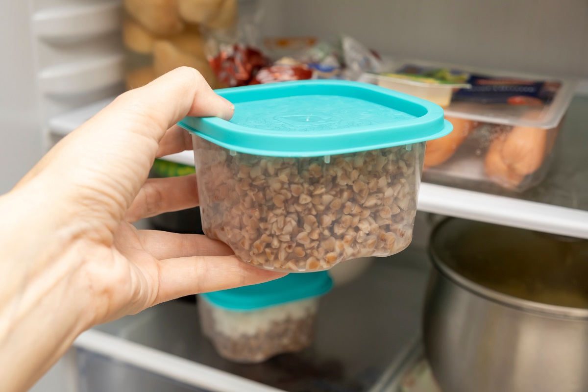 A,Hand,Of,A,Dieting,Woman,Taking,A,Plastic,Container