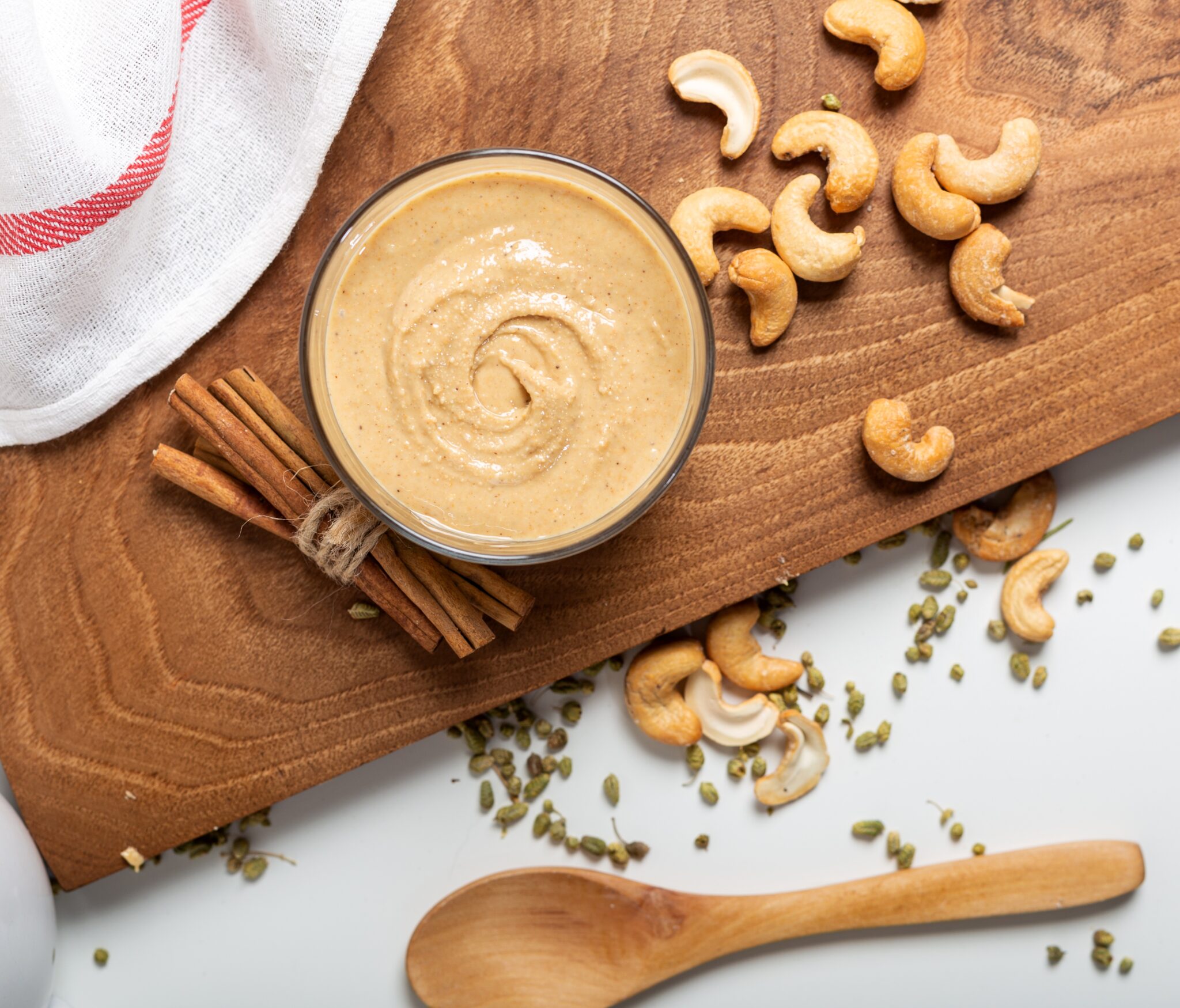 Jar,Of,Cashew,Butter,With,Cashew,Nuts,On,The,White