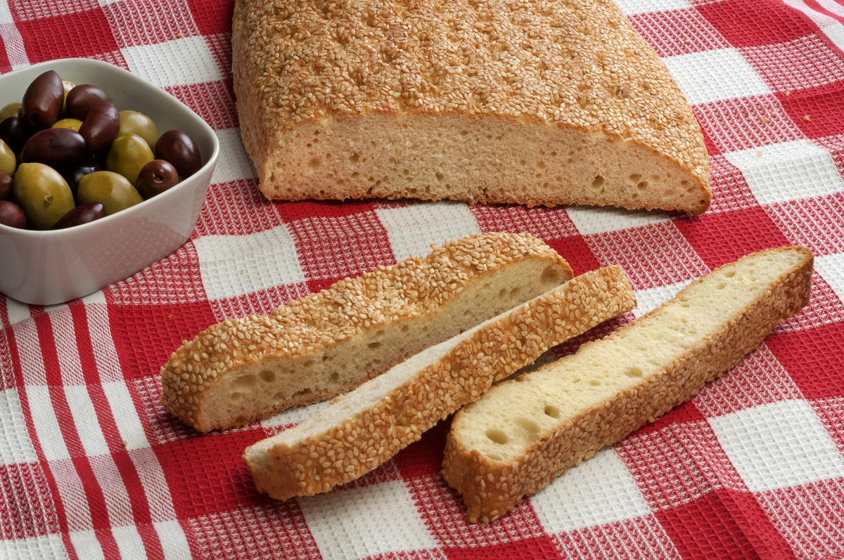 Greek,Traditional,Bread,And,Olives,On,Checkered,Table,Cloth.