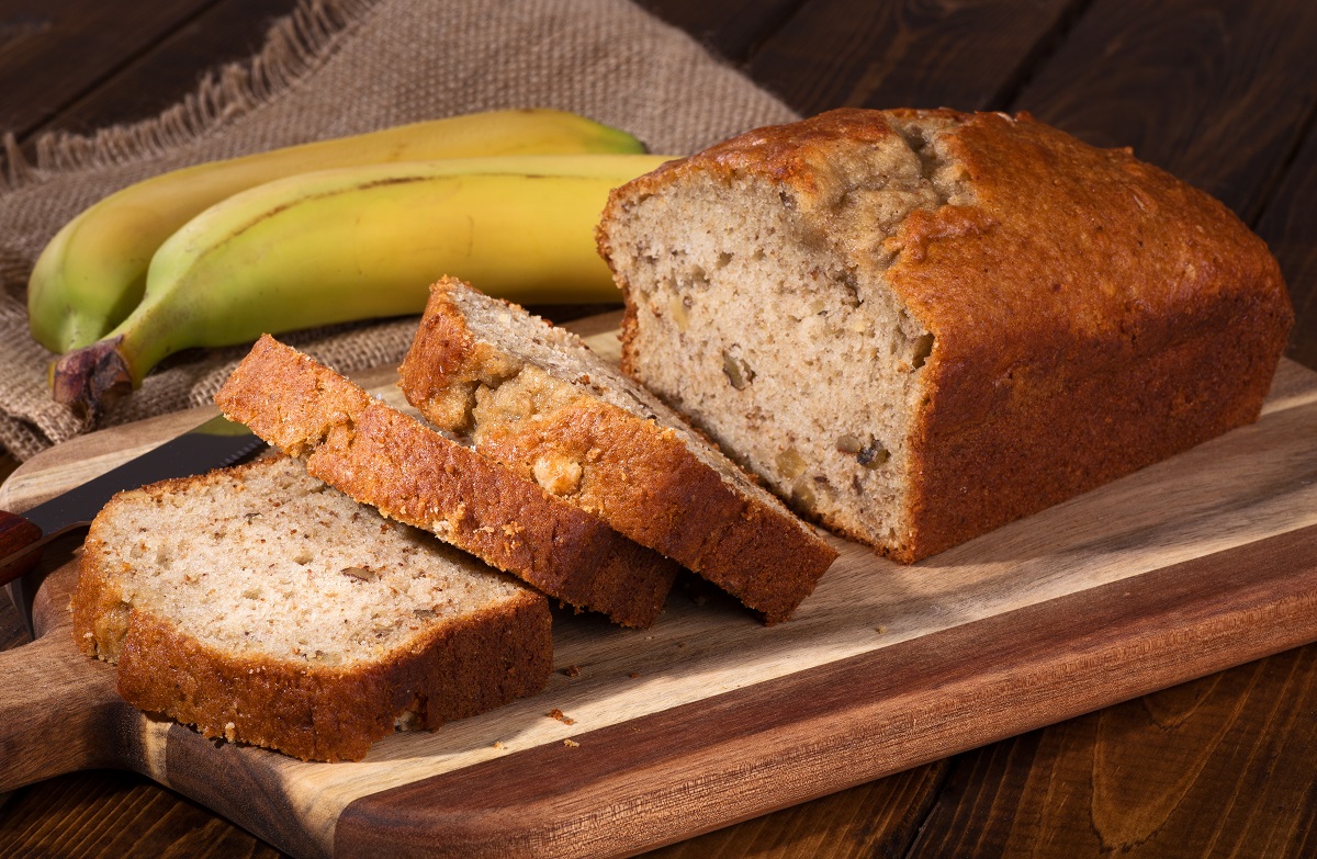 Banana,Nut,Sweet,Bread,Sliced,On,A,Wooden,Cutting,Board