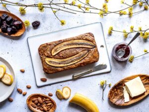 Healthy,Vegan,Banana,Bread,Served,With,Almonds,,Dates,,Vegan,Butter,