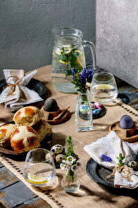 Easter,Table,Setting,With,Colored,And,Chocolate,Eggs,,Hot,Cross