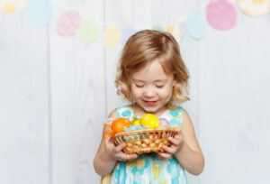 Happy,Girl,Holding,Easter,Basket