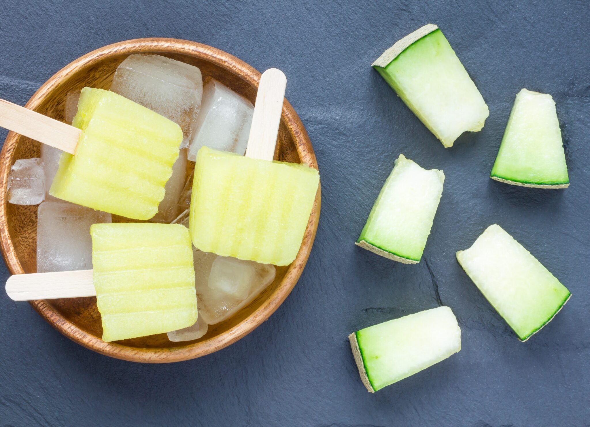 Homemade,Melon,Popsicles,On,A,Grey,Slate