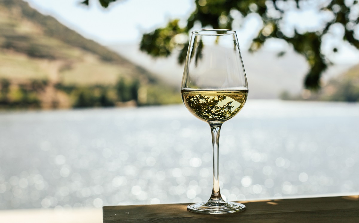 A,Glass,Of,White,Wine,Near,The,Water,,In,A