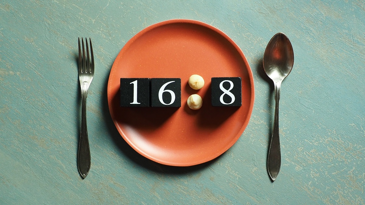 Intermittent,Fasting,Theme,Represented,By,Black,Painted,Wooden,Dice,With