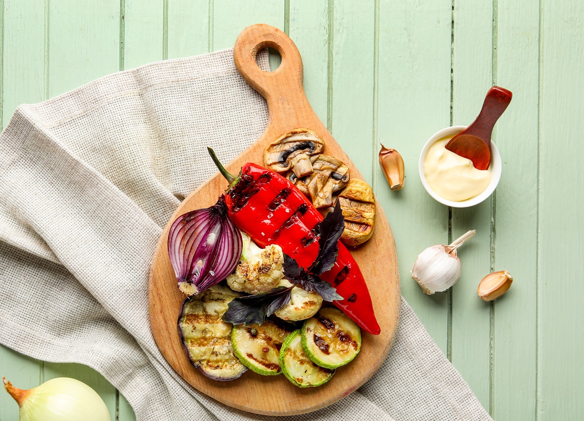 Board,With,Grilled,Vegetables,And,Sour,Cream,On,Green,Wooden
