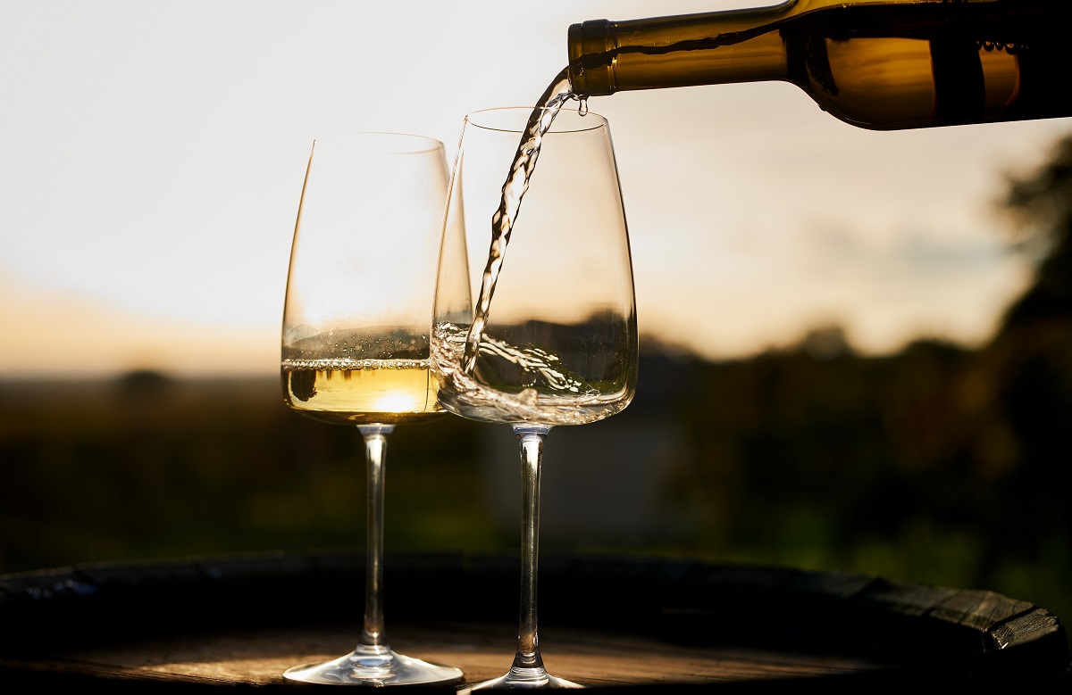 A,Sommelier,Pours,White,Wine,Into,A,Glass,On,A