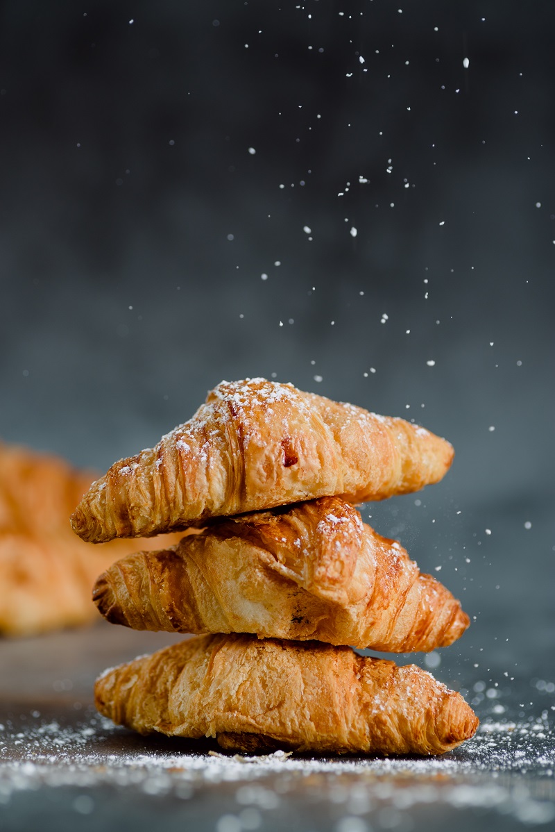 Close,Up,Of,Pile,Of,Delicious,Croissants,On,A,Dark