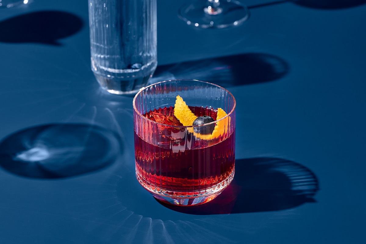 Popular,Cocktail,Negroni,With,Gin,And,Vermouth,On,Blue,Background