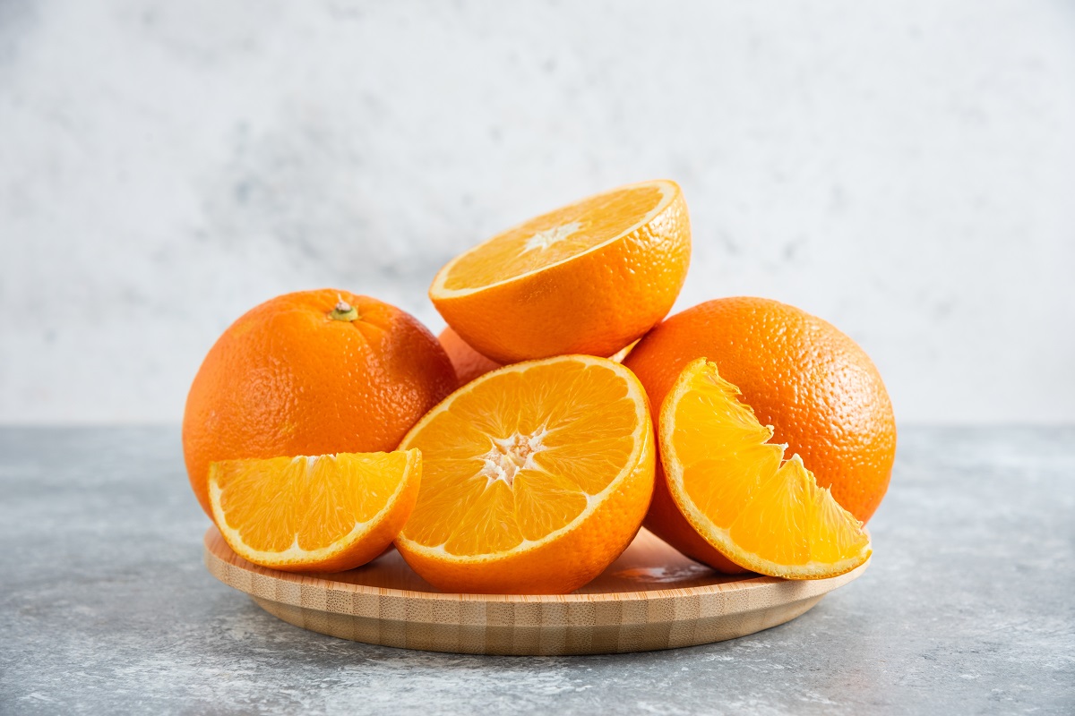 Front,View,Fresh,Sliced,Orange,On,Dark,Background,Ripe,Mellow
