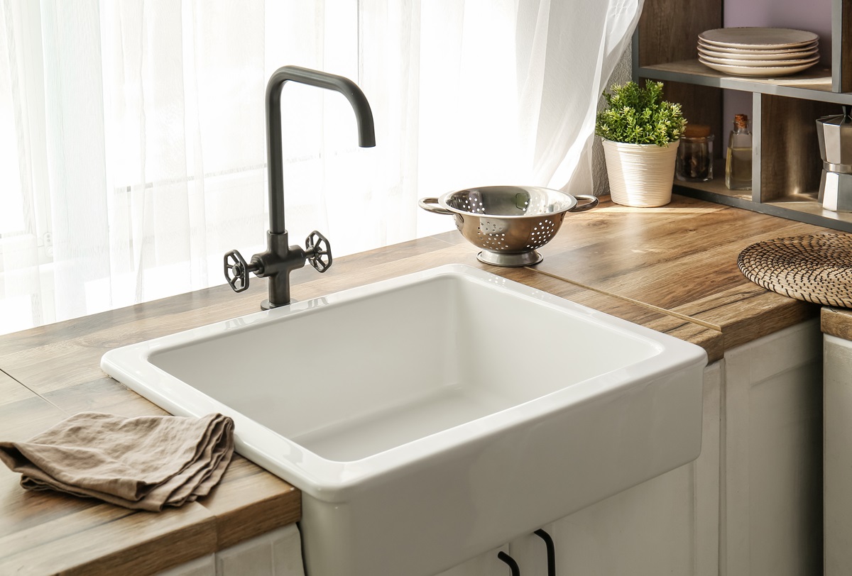 White,Ceramic,Sink,On,Wooden,Counter,Near,Window,In,Comfortable