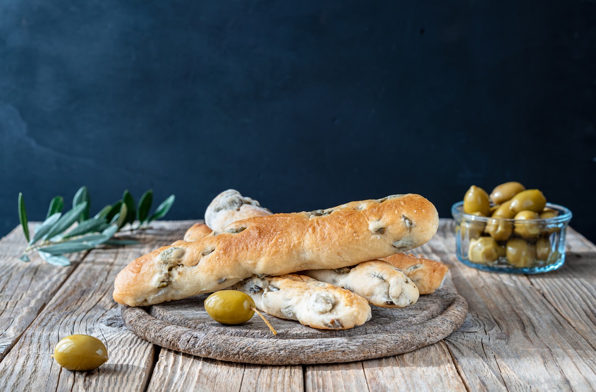 Group,Of,Bread,Sticks,Stuffed,With,Green,Olives,Ion,Cutting