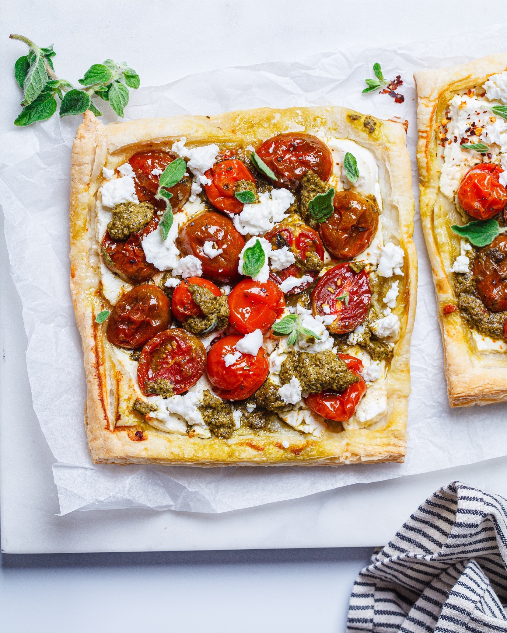 Pesto,,Tomato,And,Feta,Tarts,,Top,View.,Summer,Italian,Recipe.