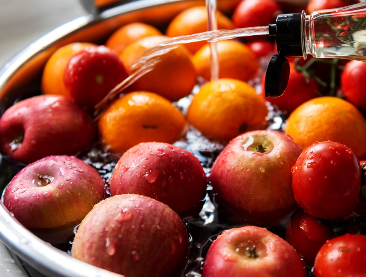 Red,Apples,,Red,Tomatoes,And,Orange-colored,Oranges,Are,Washed,With