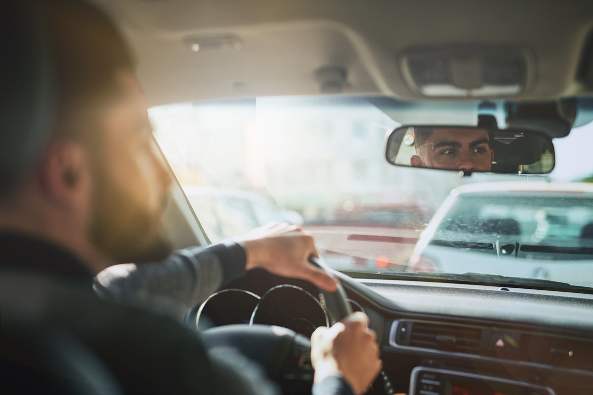 Hands,,Steering,Wheel,And,Man,In,A,Car,For,Road