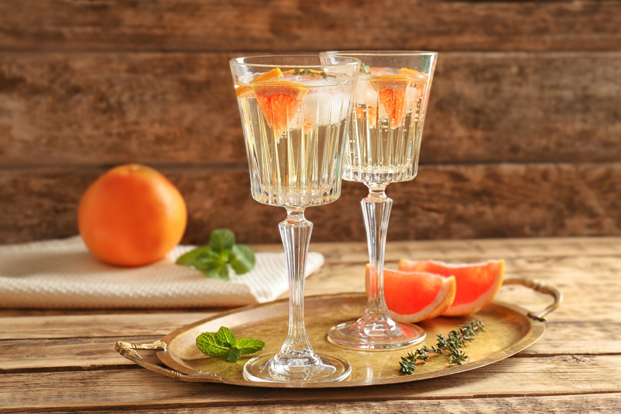 Tray,With,Refreshing,Cocktails,And,Grapefruit,On,Wooden,Table