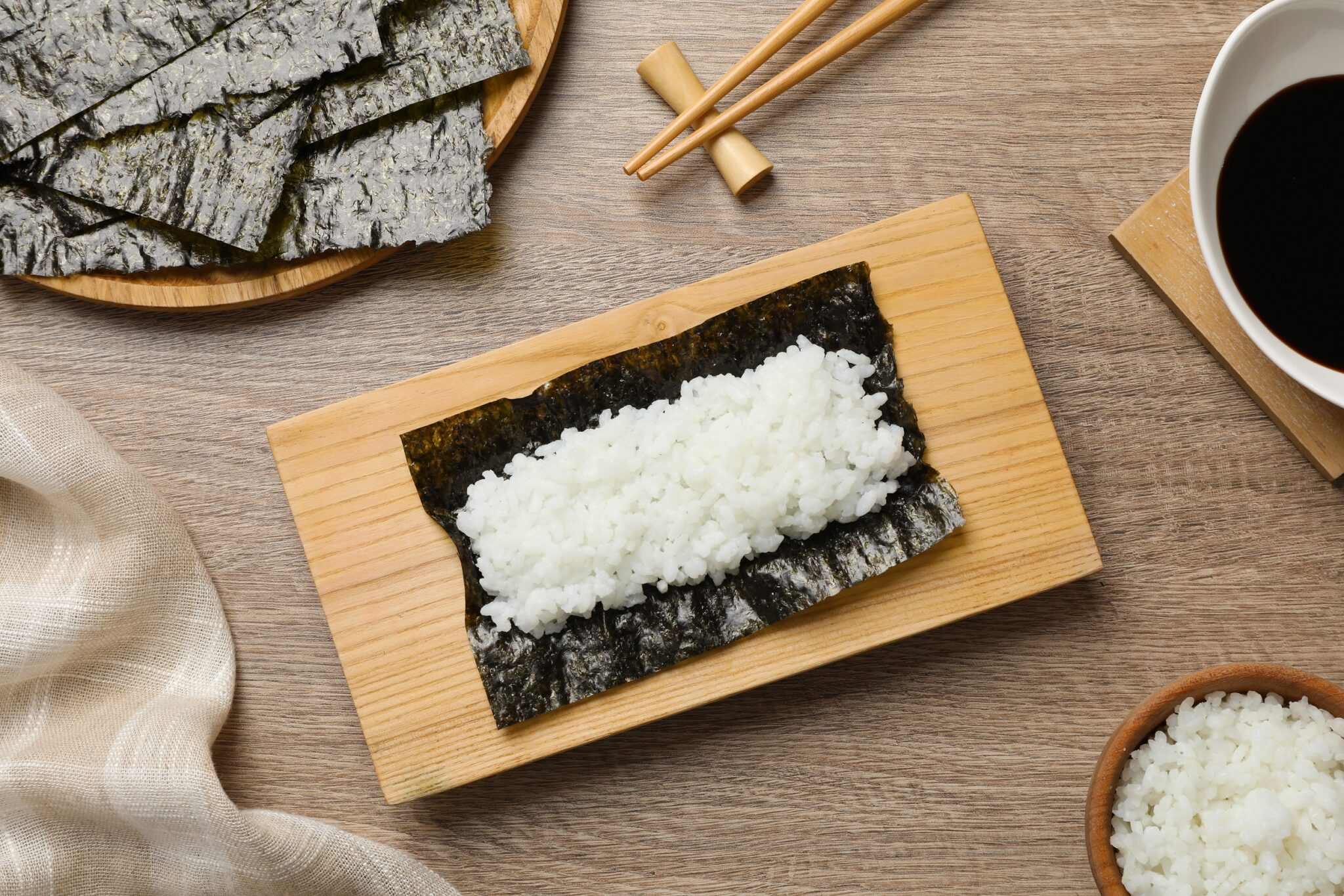 Dry,Nori,Sheet,With,Rice,On,Wooden,Table,,Flat,Lay