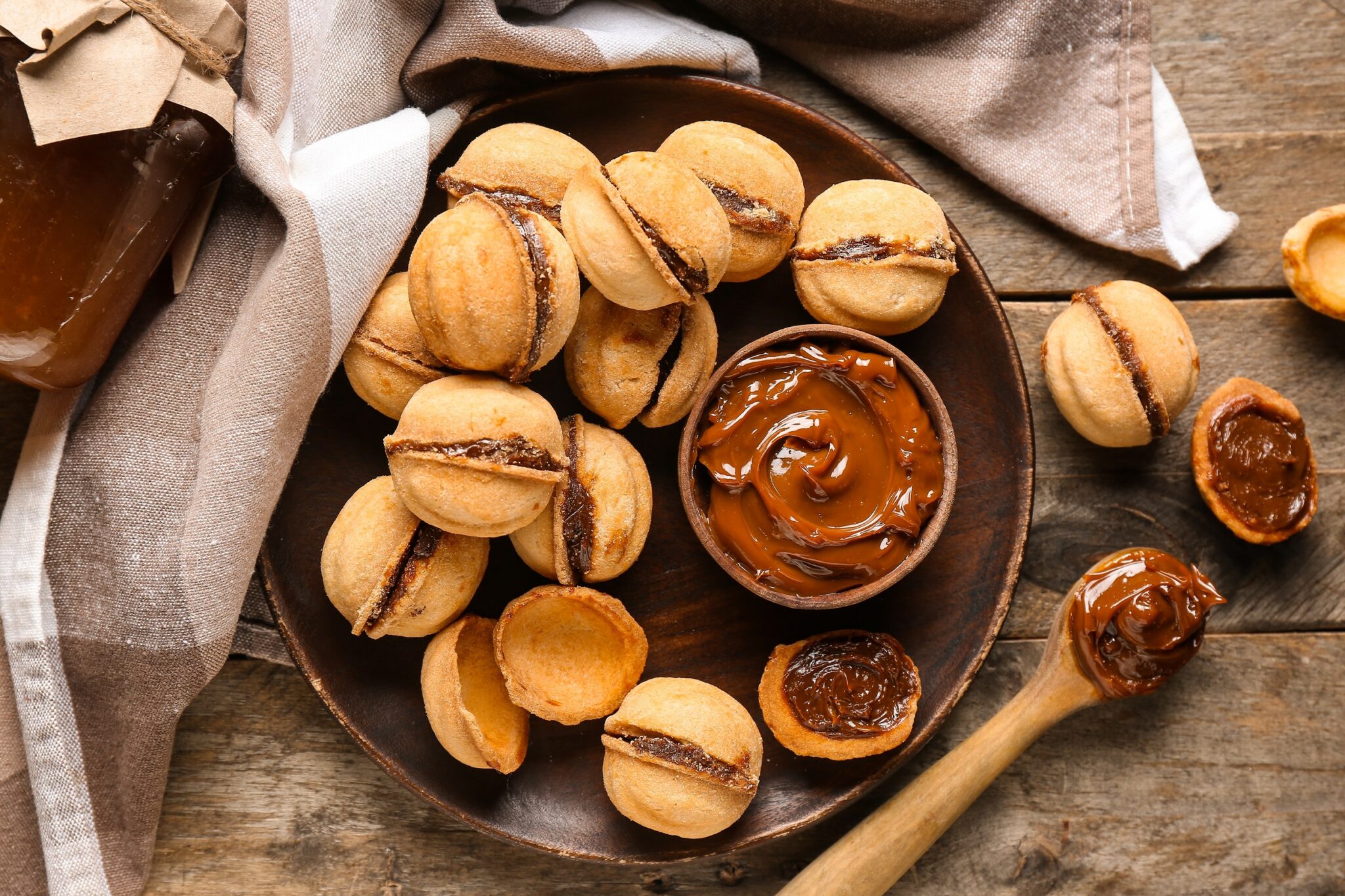 Plate,With,Sweet,Walnut,Shaped,Cookies,With,Boiled,Condensed,Milk