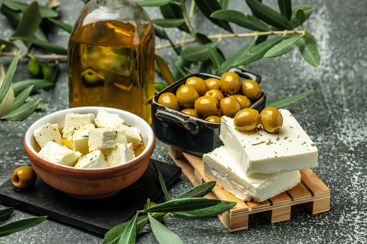 Feta,Cheese,With,Olives,And,Olive,Oil,Sauce,In,Bowl
