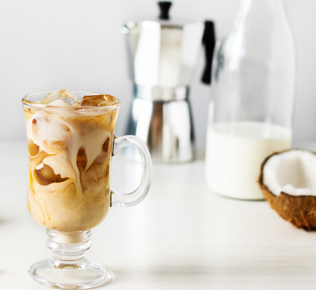 Iced,Coffee,With,Coconut,Milk,In,A,Tall,Glass,On