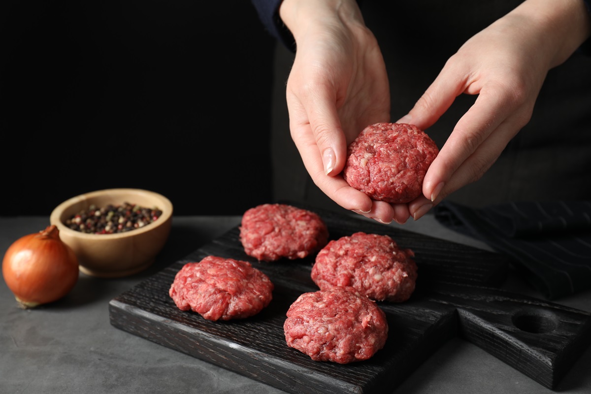 Woman,Making,Meatball,From,Ground,Meat,At,Grey,Table,,Closeup