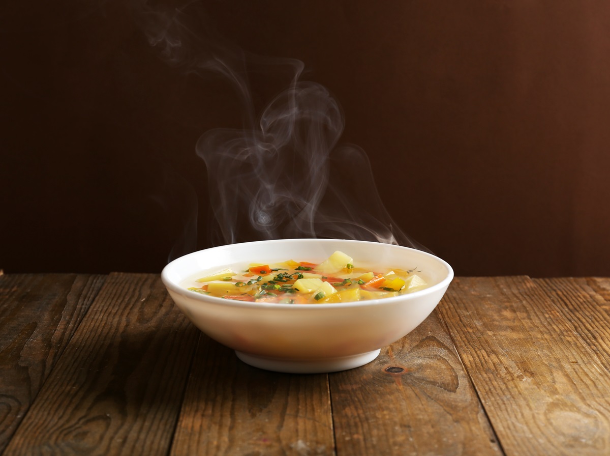 Delicious,Home,Cooked,Food,With,Steam,On,Table,On,Brown