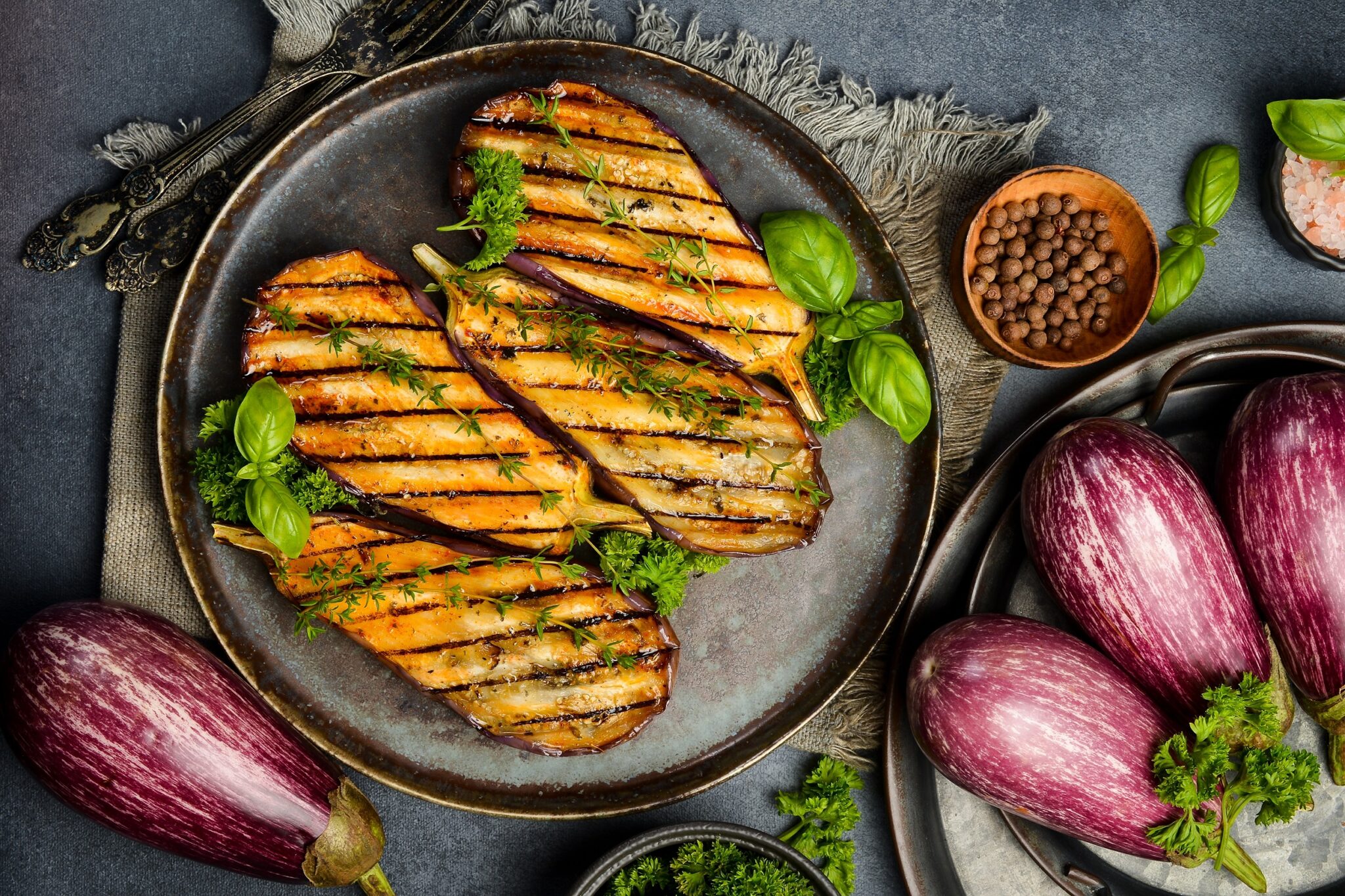 Juicy,Baked,Eggplants.,Grilled,Vegetables.,On,A,Gray,Concrete,Background.