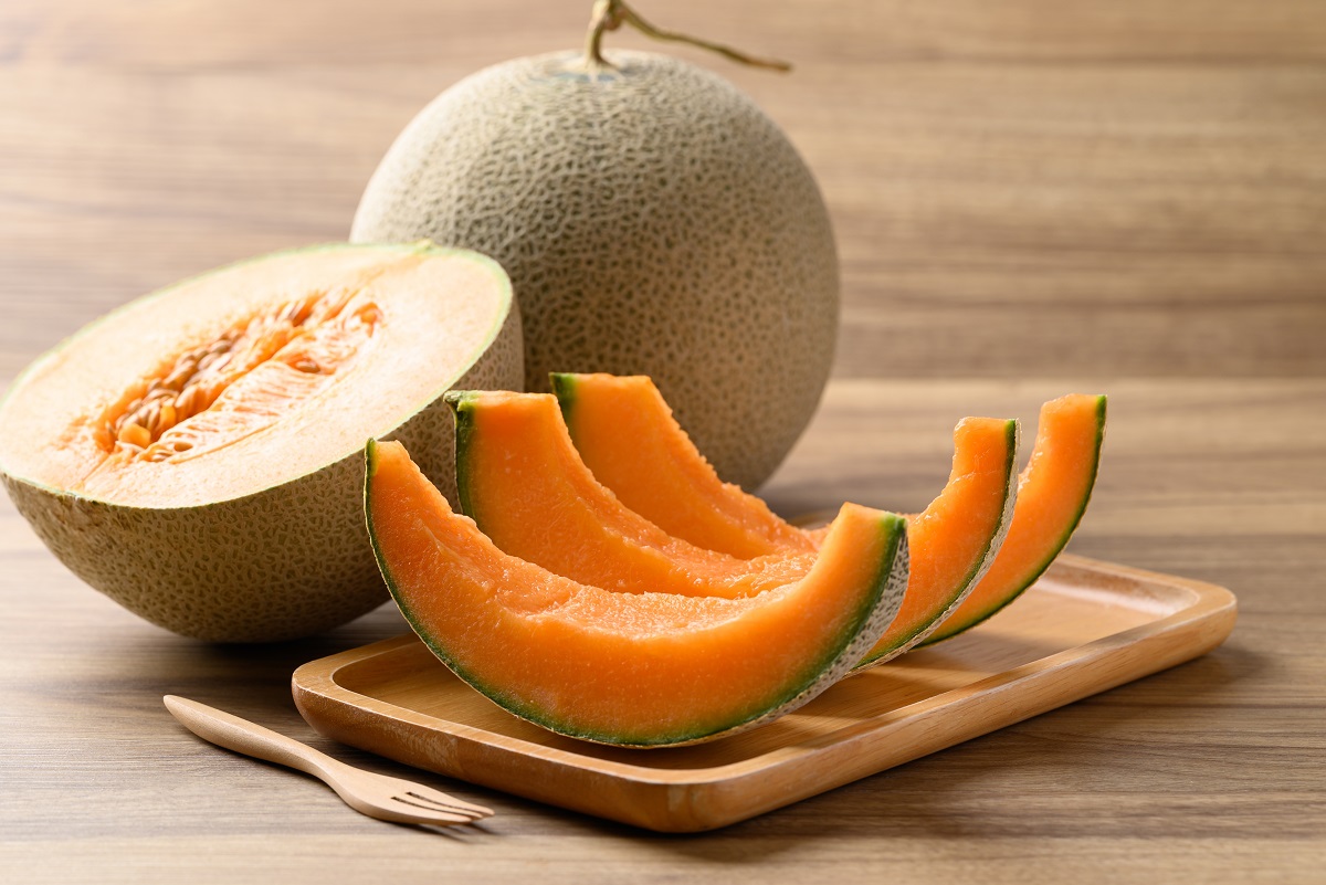 Sliced,Orange,Melon,,Musk,Melon,Or,Flesh,Melon,On,Wooden