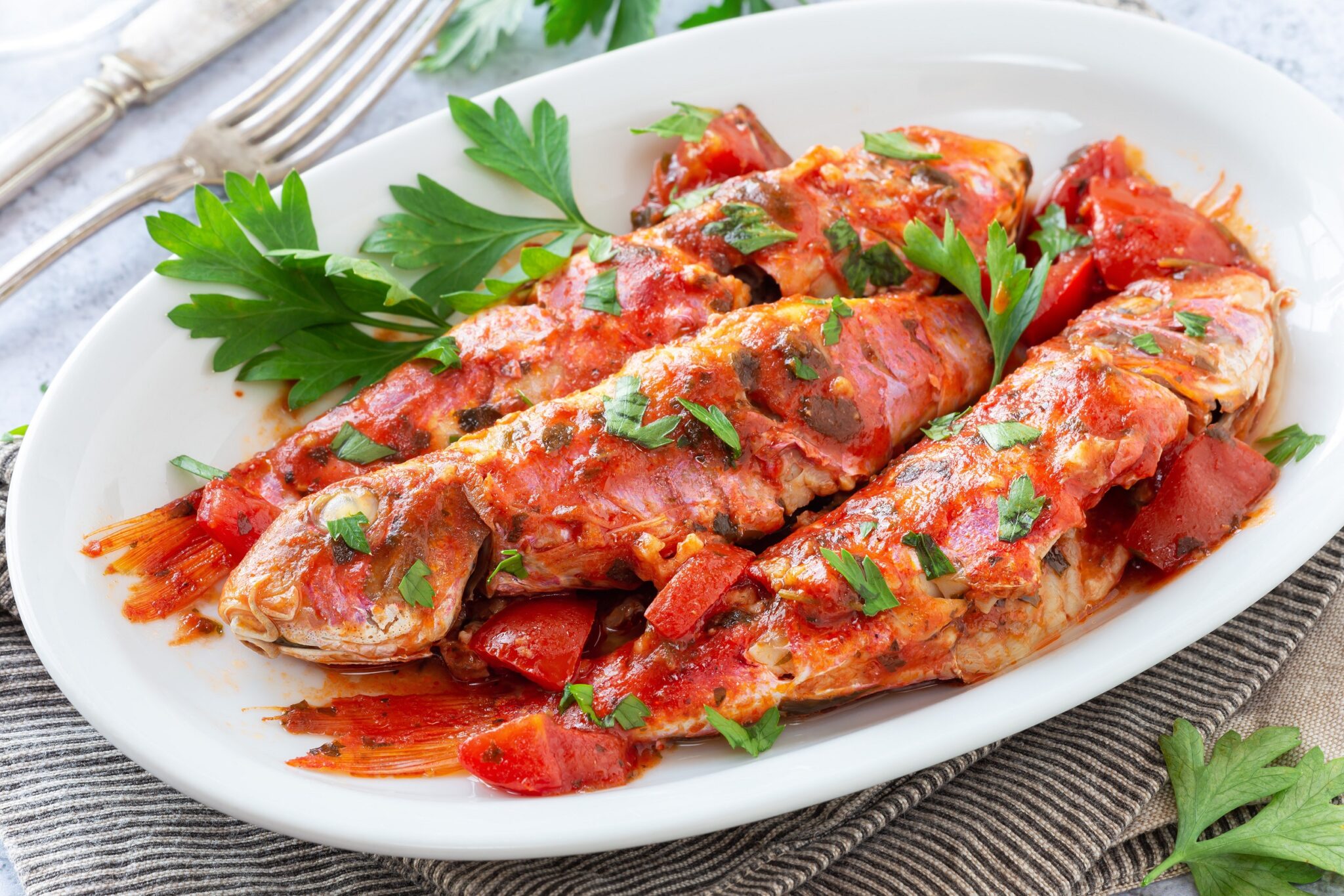 Cooked,Red,Mullet,Fish,In,Tomato,Sauce,With,Garlic,And