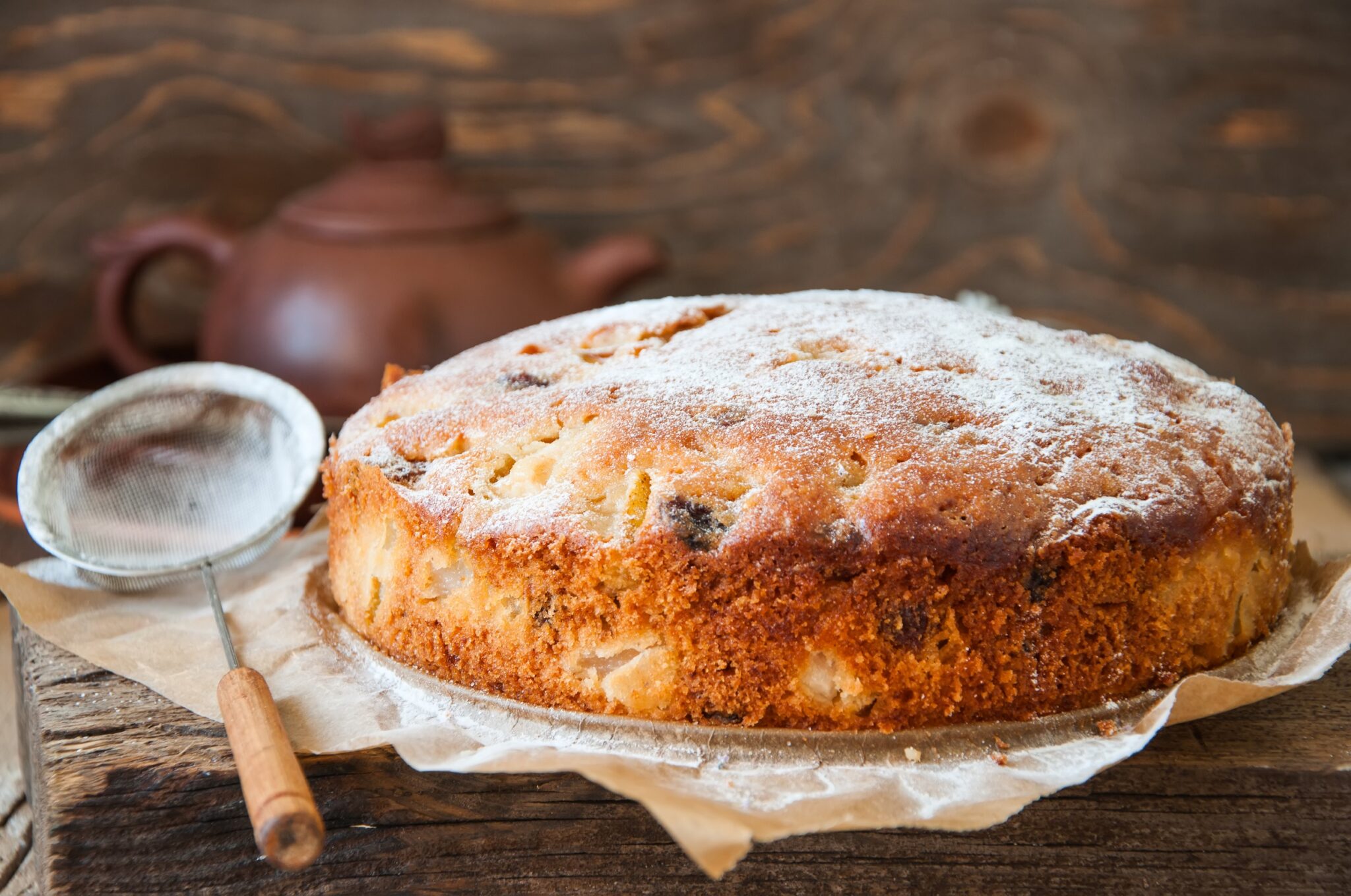Freshly,Baked,Homemade,Cake,With,Pear,And,Raisin,Sprinkled,With