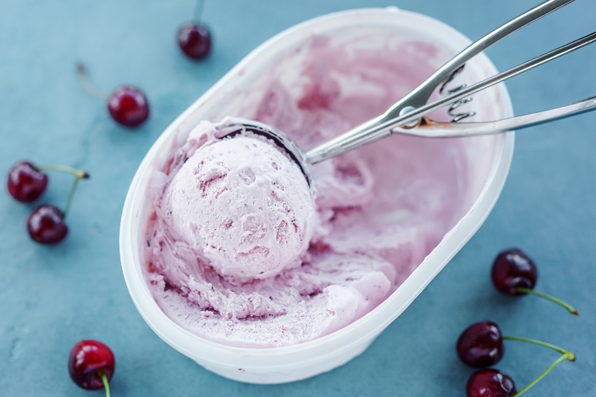 Tasty,Refreshing,Ice,Cream,With,Cherry,In,Plastic,Box,On