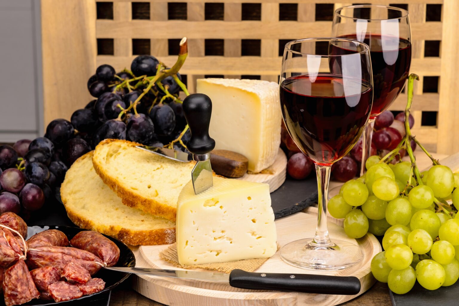 Glasses,Of,Red,Wine,With,Cheese,,Italian,Salami,,Grapes,And
