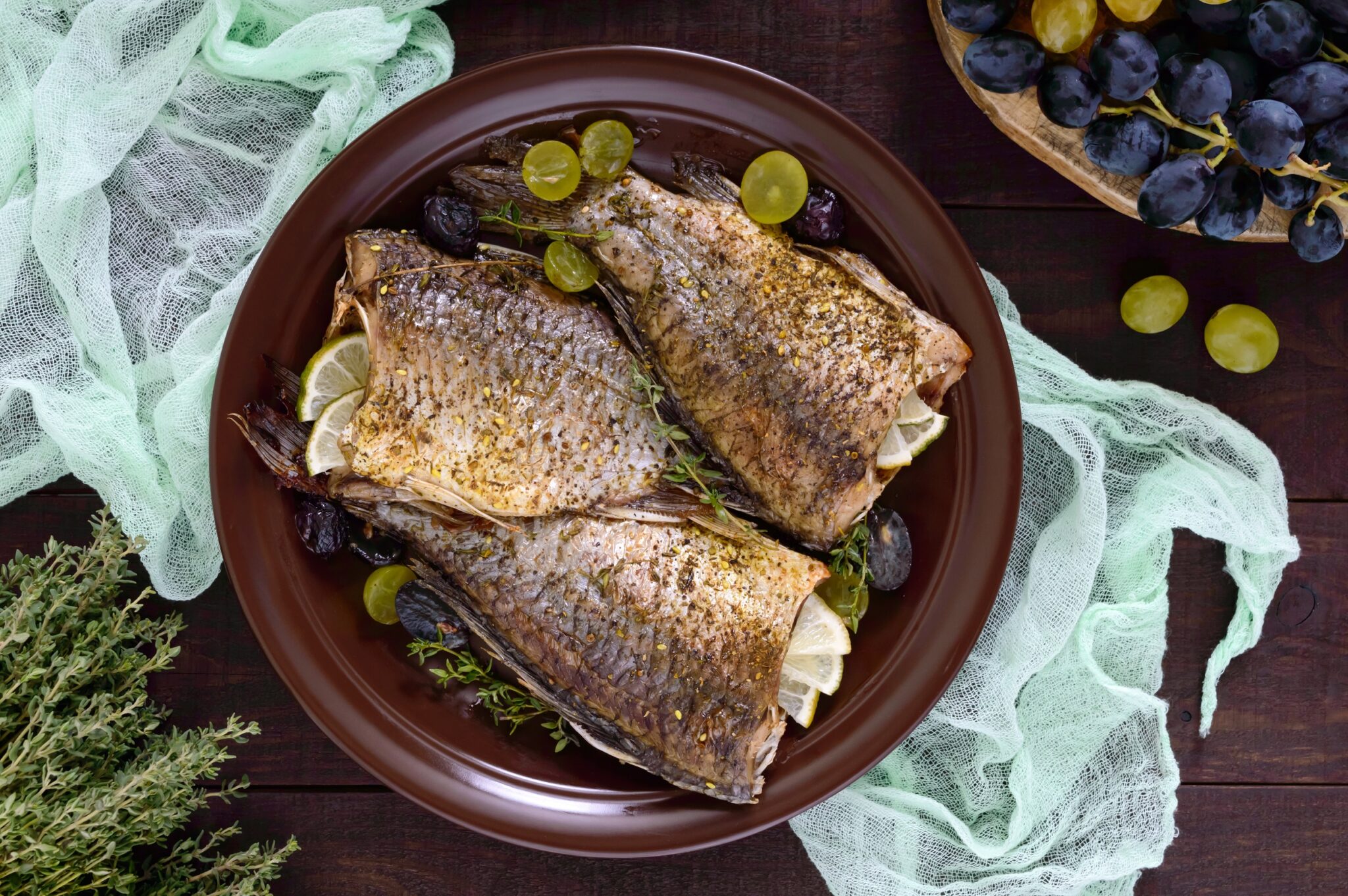Baked,Carp,With,Grapes,And,Herbs,On,A,Ceramic,Dish