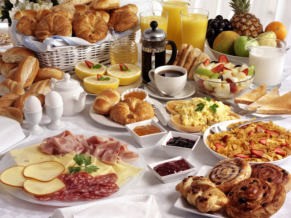 Breakfast,Table,Filled,With,Assorted,Foods,savoury,sweet,pastries,hot,And,Cold,Drinks